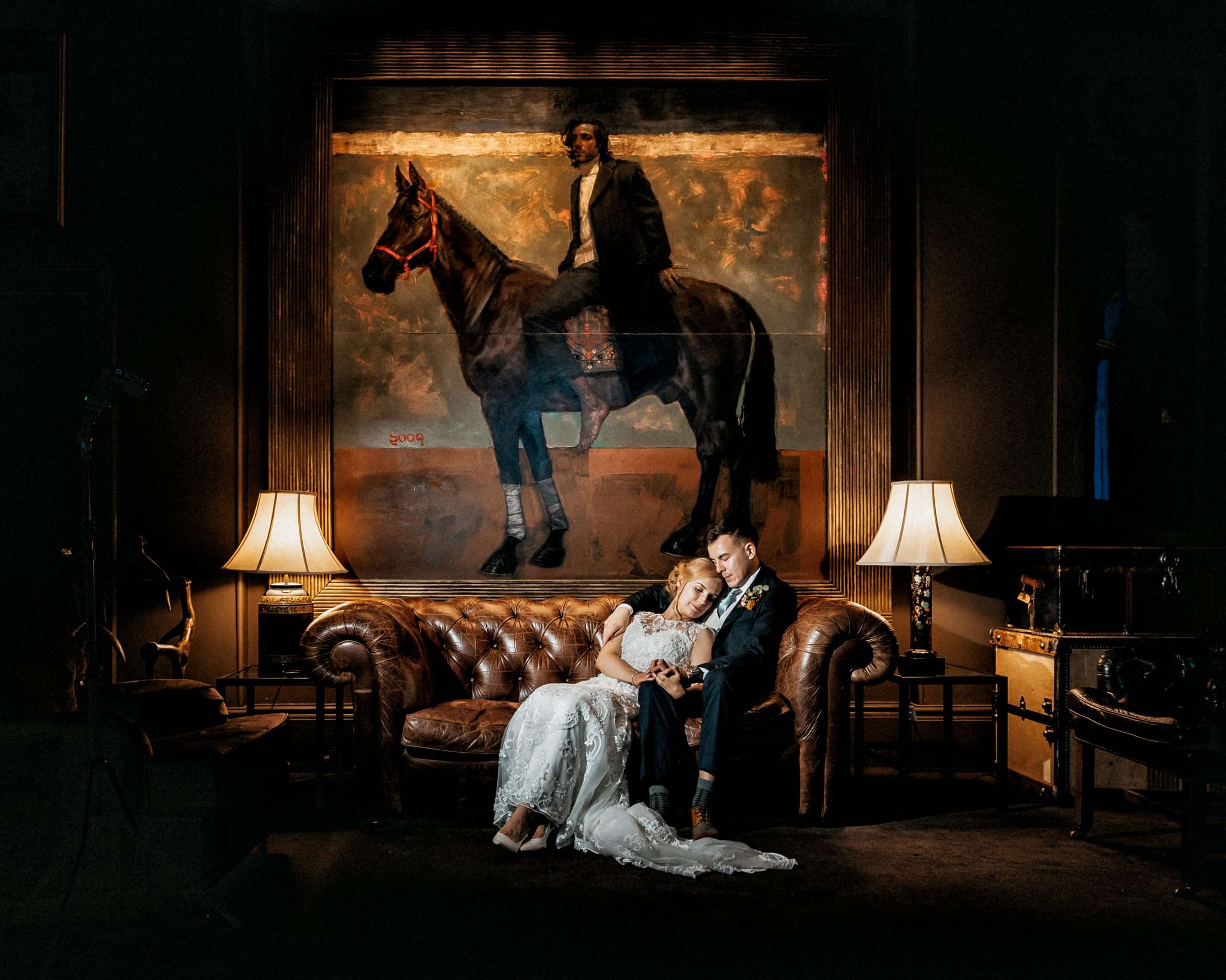PORTFOLIO 25 Bride and groom sat on a sofa being photographed by Stubton Hall wedding photographer