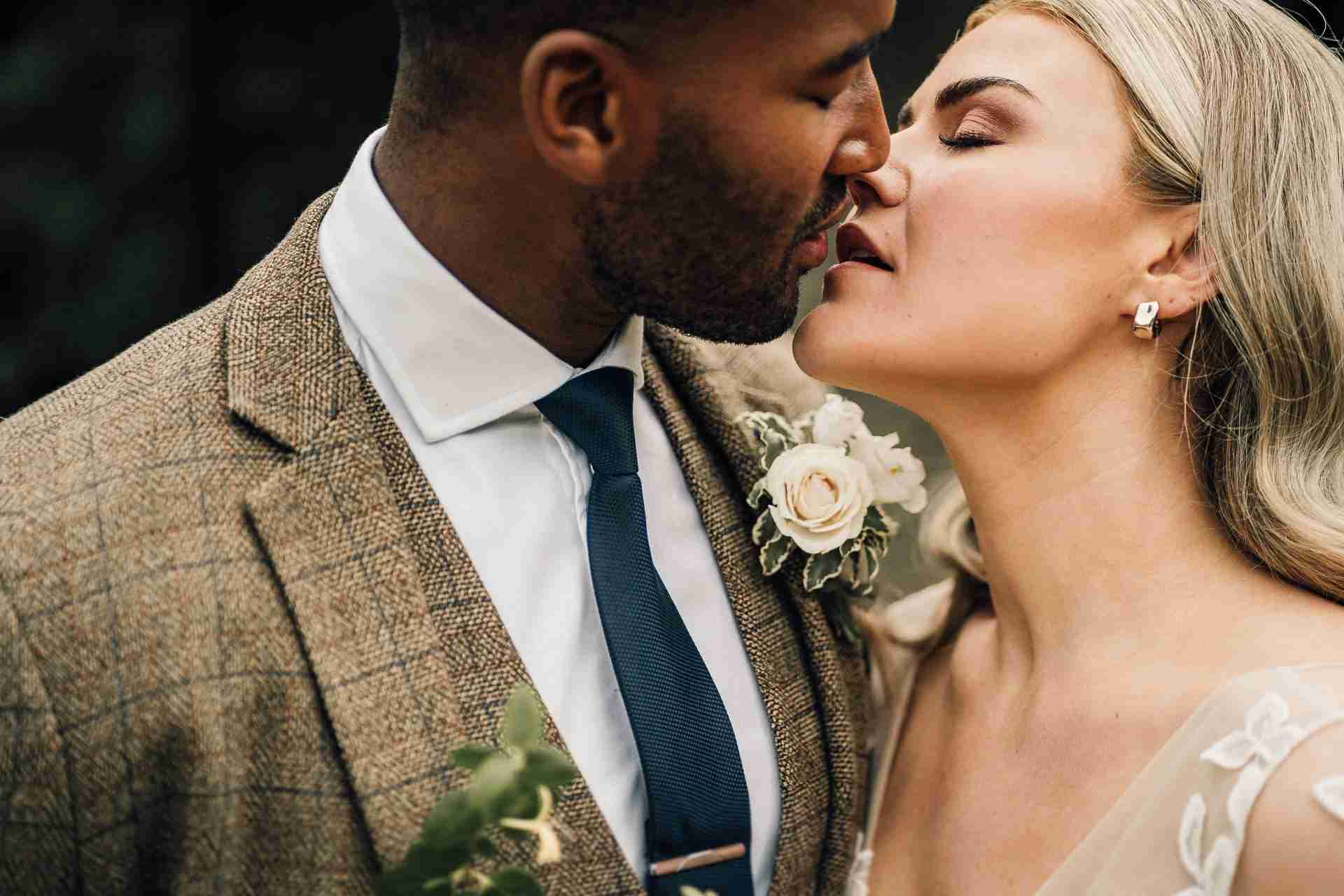 LANDING PAGE | Recommended Suppliers 11 bride and groom kiss after wedding first look
