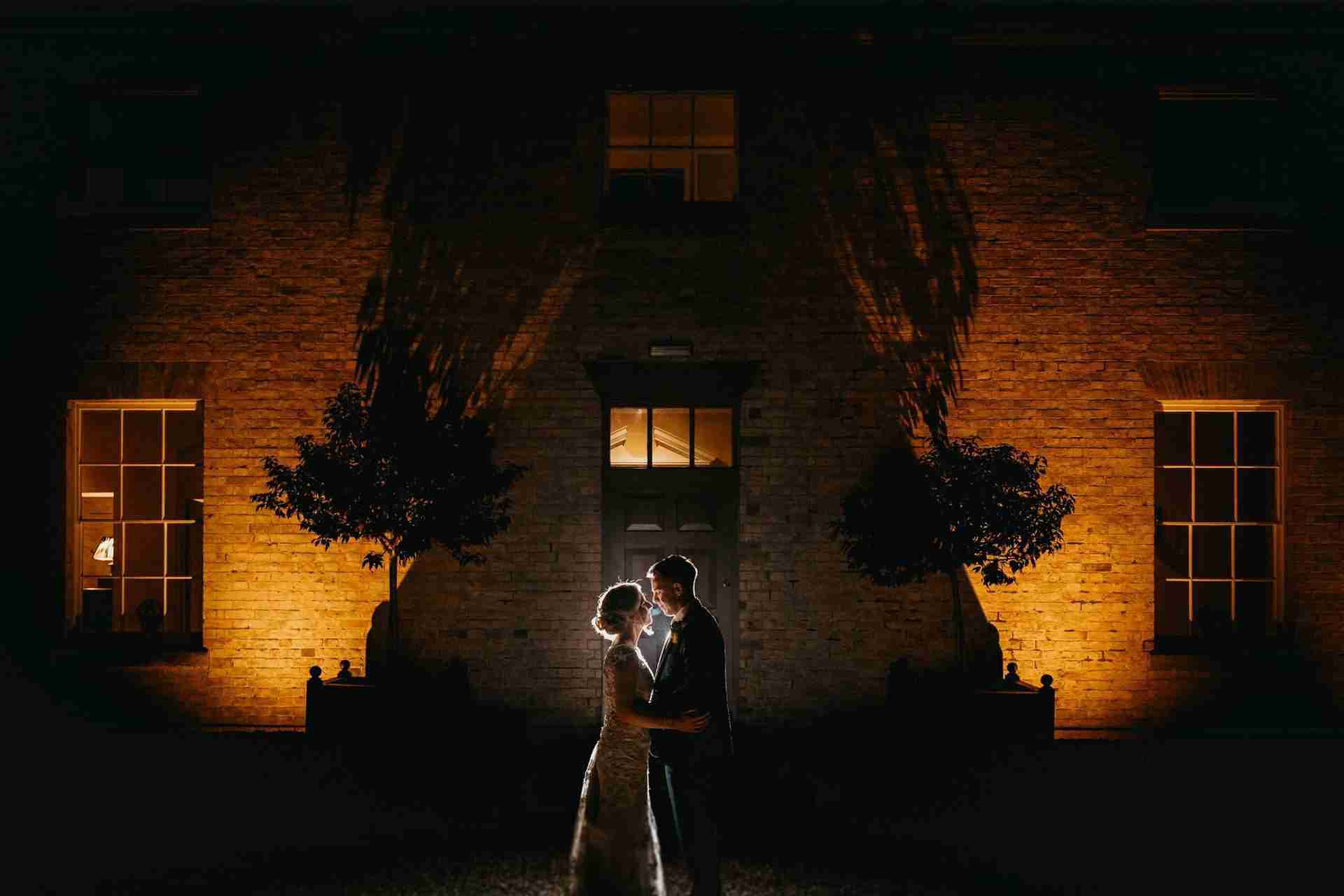 PORTFOLIO 40 Bride and groom stood outside the main entrance of Stubton Hall wedding venue