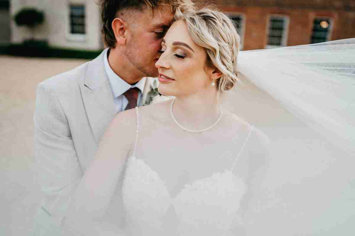 STUBTON HALL | Amy & Will 5 Stubton Hall wedding photography of man kissing a woman in a wedding dress