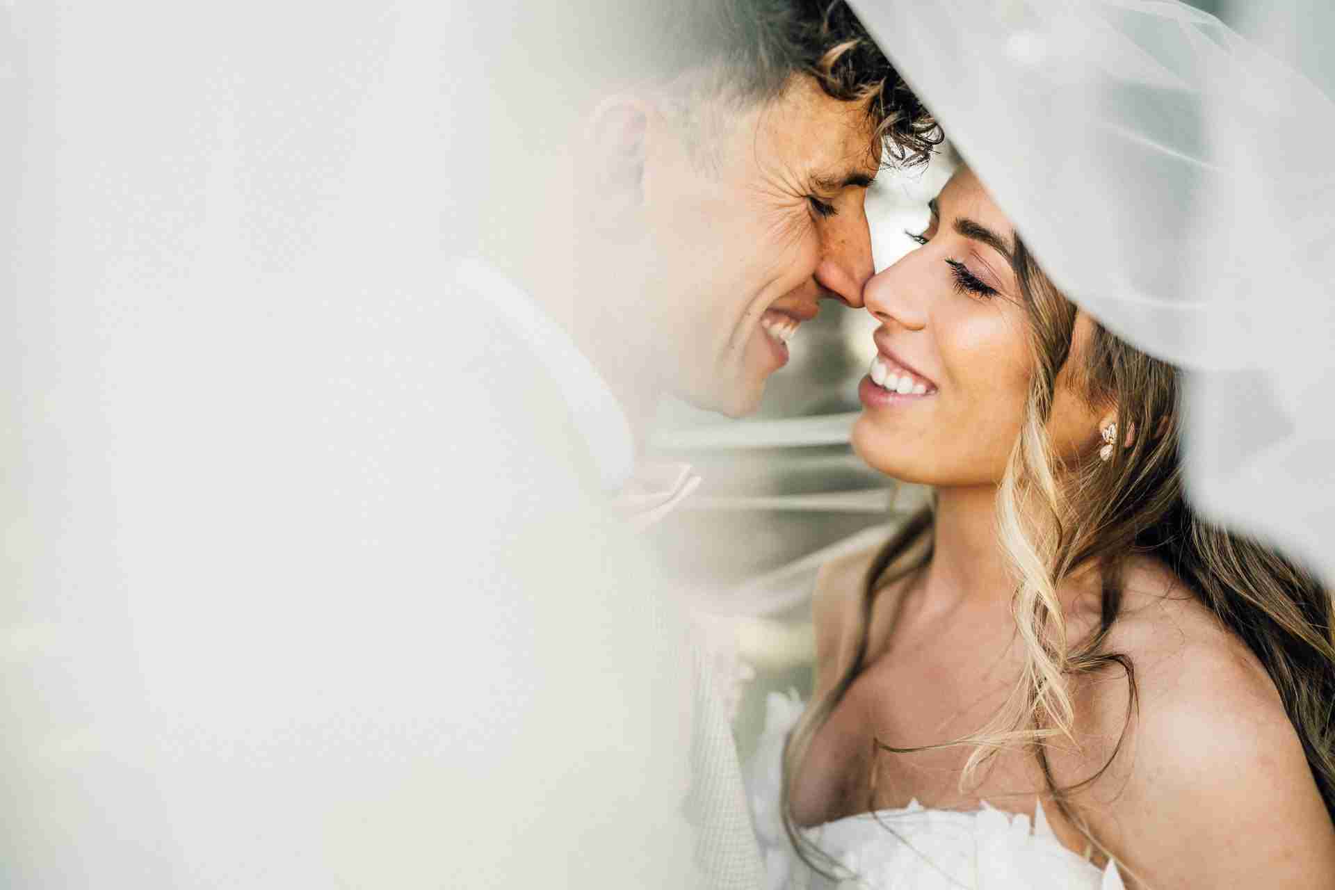 PORTFOLIO 60 bride and groom embrace at a wedding venue with tipi reception