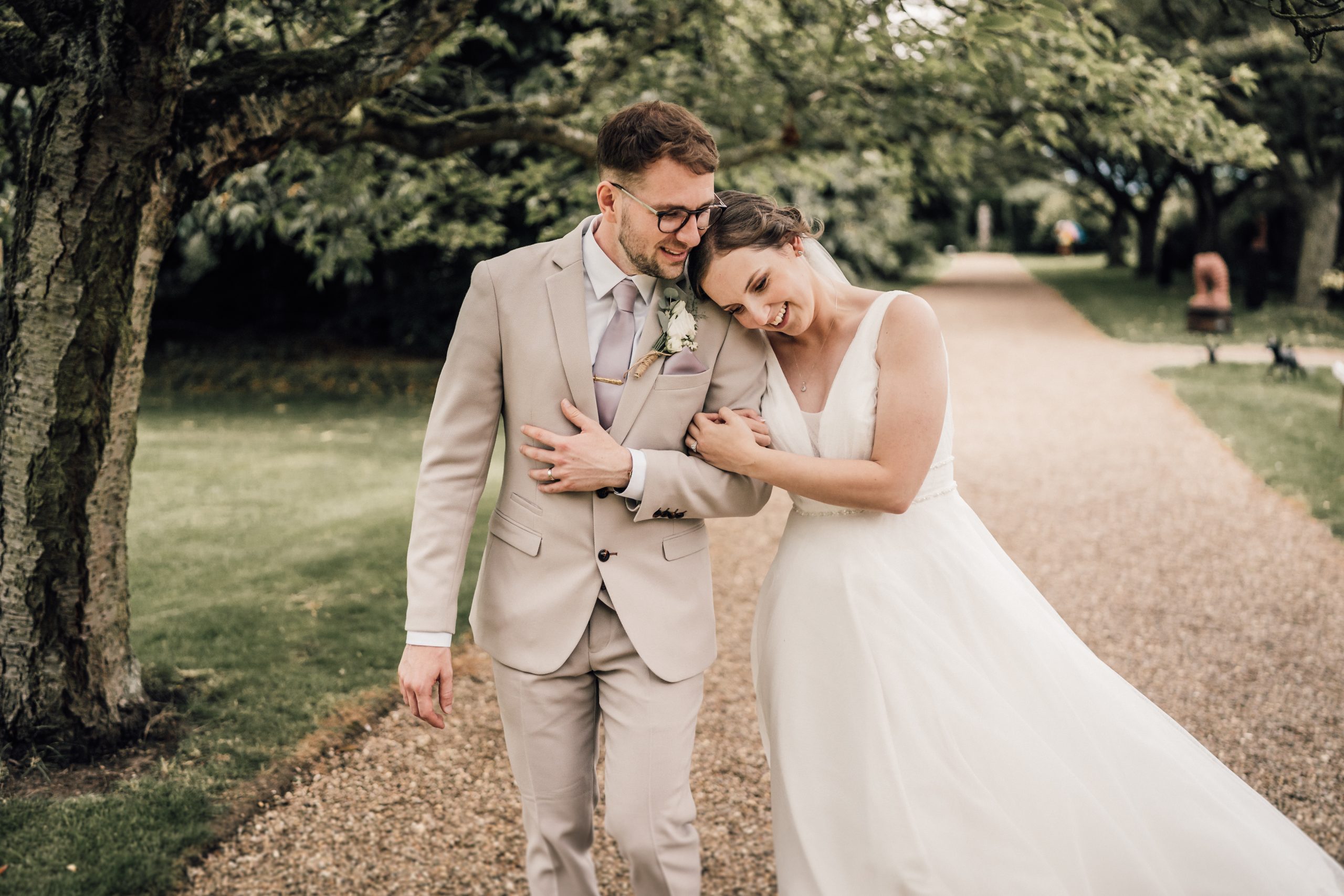 HOME 19 wedding photographer Lincoln photographing man and woman walking