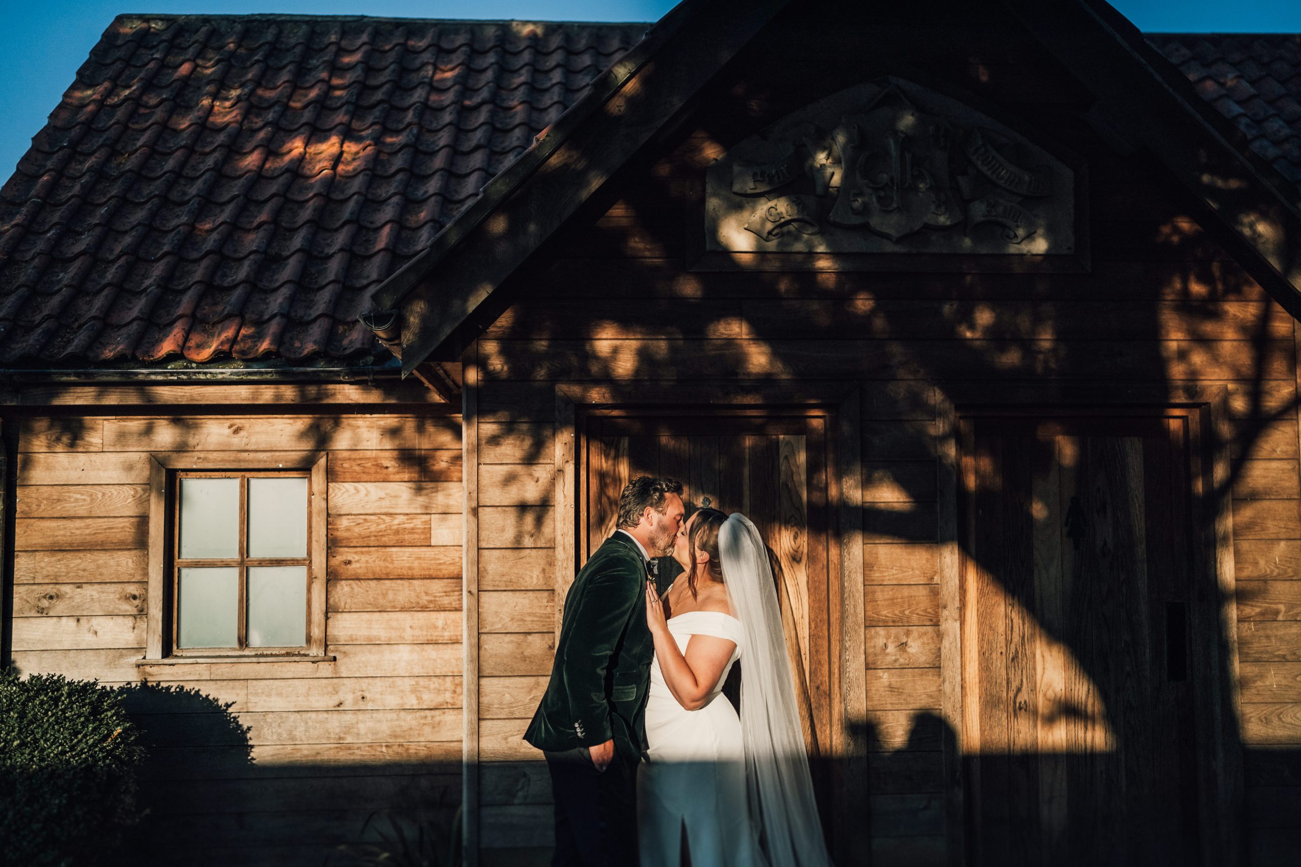 PORTFOLIO 77 a man and woman standing in front of a house