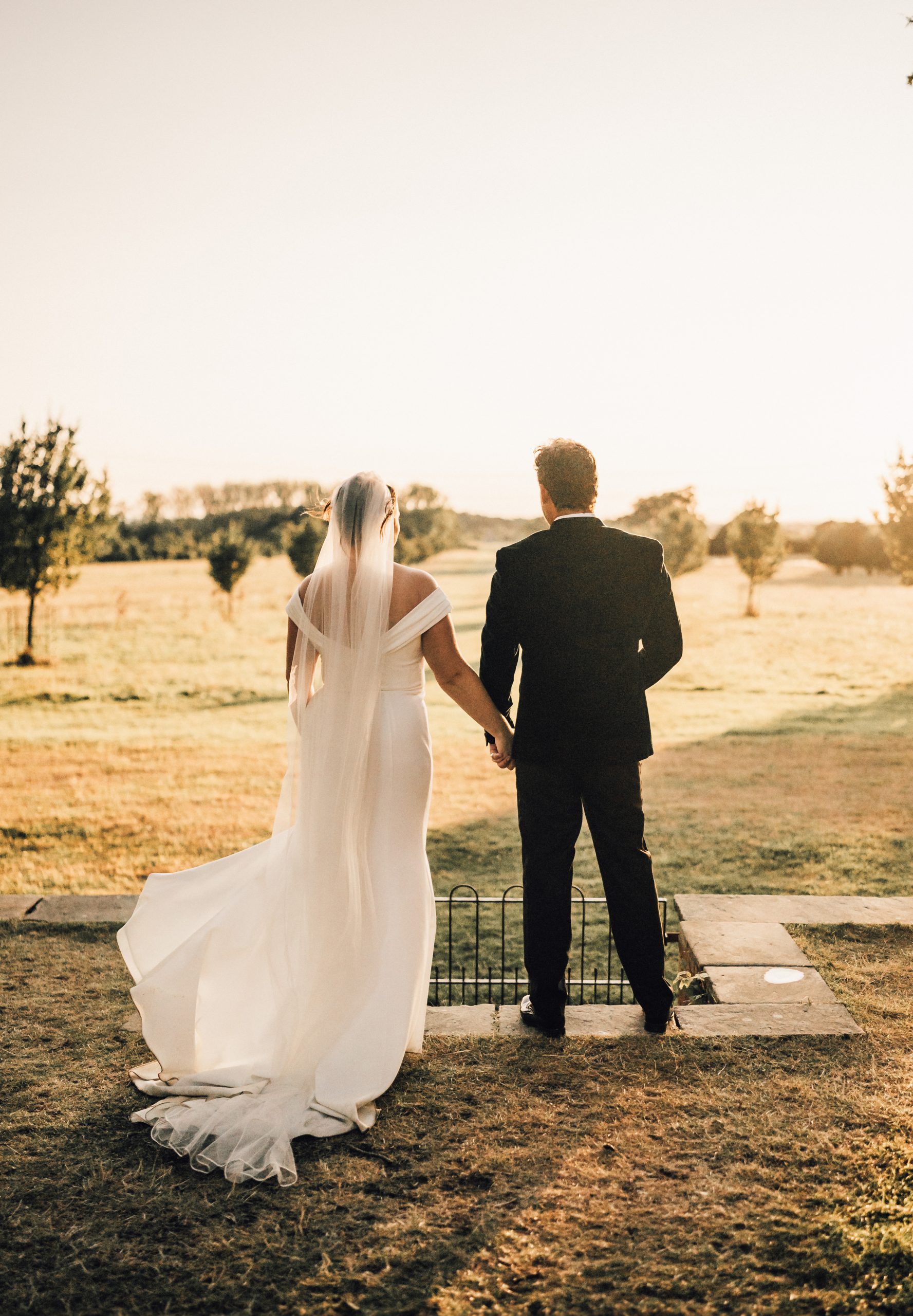 PORTFOLIO 43 a man and woman in a suit holding hands