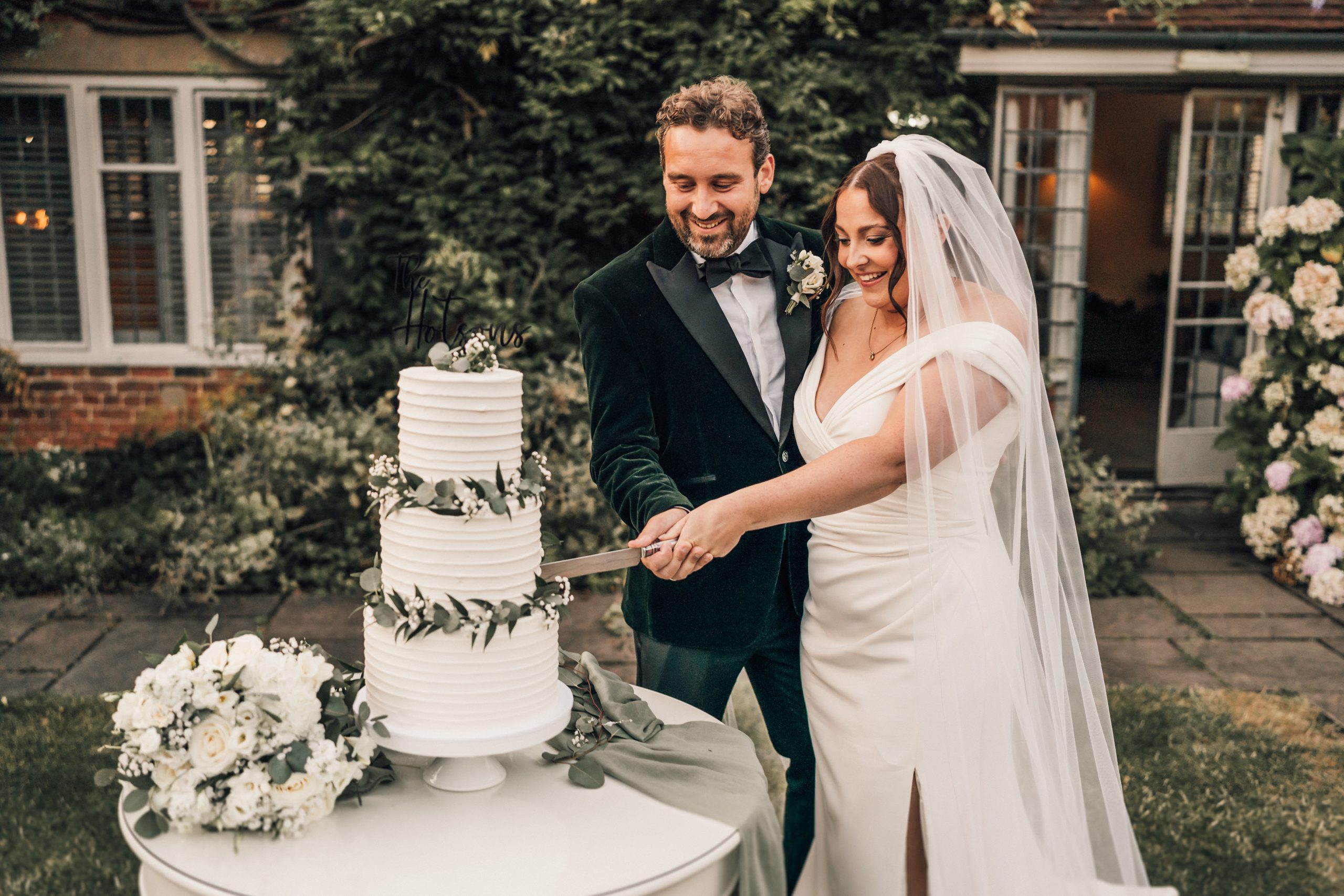 VENUE GUIDE | Doddington Hall 62 a man and woman cutting a wedding cake