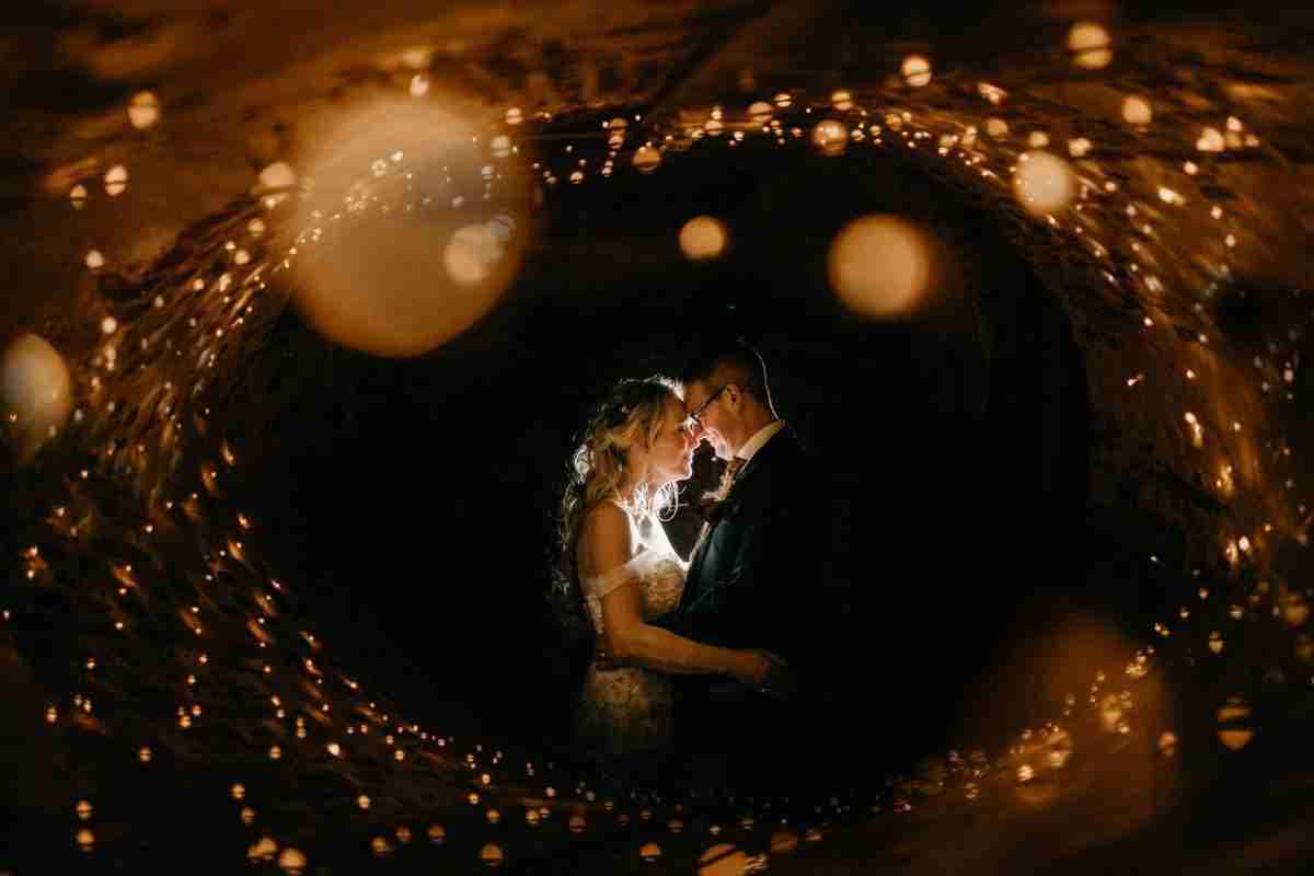 HIRST PRIORY | Deborah & Matt 12 a man and woman kissing in a tunnel