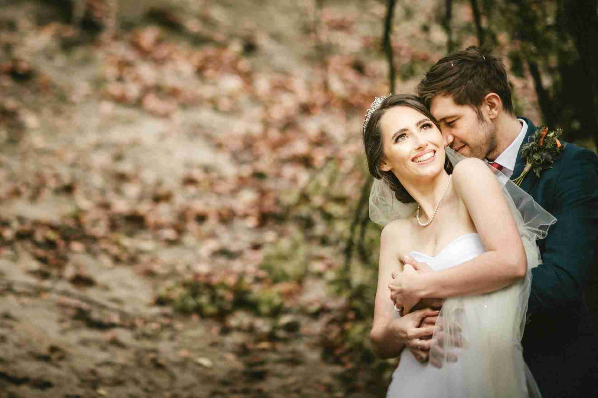 PORTFOLIO 98 bride and groom hugging photographed by Nottinghamshire wedding photographer